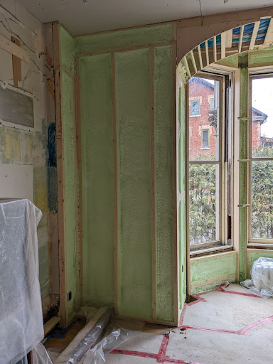 Photograph of insulation as well as part of the arched frame for the bay window which will be trimmed in curved oak. 